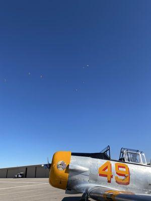 Vintage airplane, in the sky parachuters