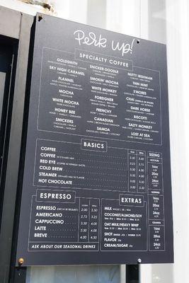 view of menu board located right next to drive-through window