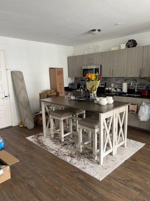 Dining table with chairs and rug