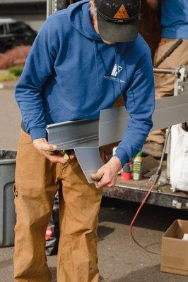 Pacific Gutter installer custom cutting Gutter Shutter gutters for a home