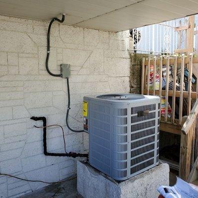 Air conditioner swap out. The old unit was about 35-40 years old!  This new unit fits in  quite nicely.