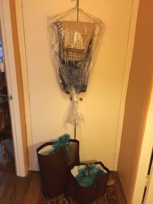 12 pounds of women's clothing and a set of queen sized sheets