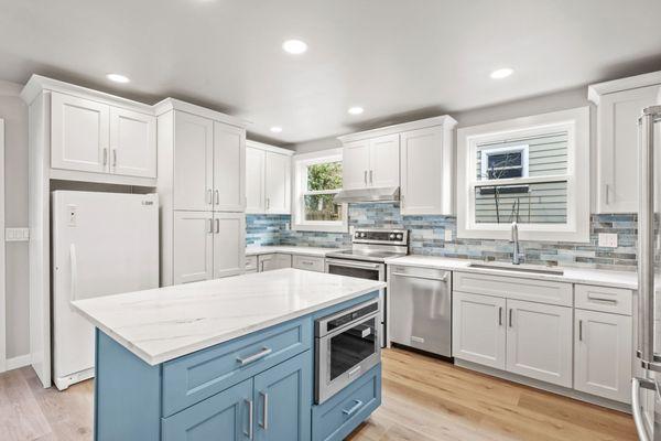 Custom two toned white and blue cabinetry. Built in's with Kitchen Island, with Remodel completed by Nordic Home Solutions