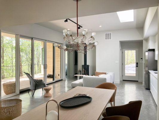 The living space is central, flanked by a guest wing and a master suite wing. They face away from each other to maximize privacy.