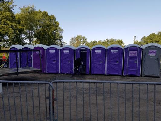 John To Go Porta Potties and barricade fence