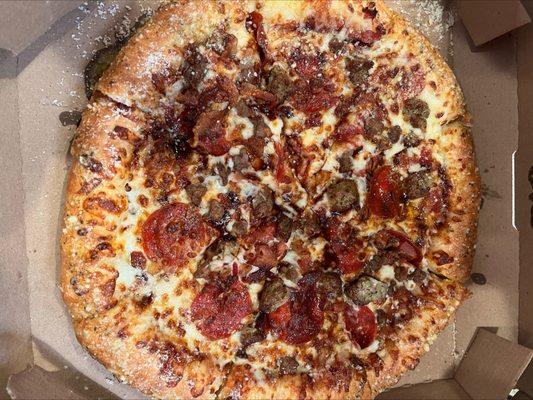 Parmesan Stuffed Crust Pizza with pepperoni, beef, bacon, Italian sausage, and extra cheese.