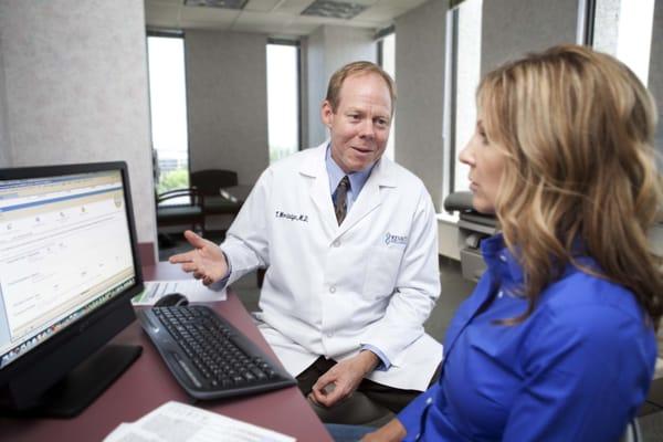 Dr. Tom explains results to a patient