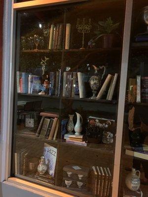 Decorations at the window of the speakeasy. Look for this to identify