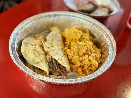 Carne asada and brisket tacos with rice.