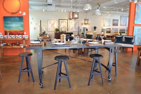 Steel island on wheels with custom wood bar stools.