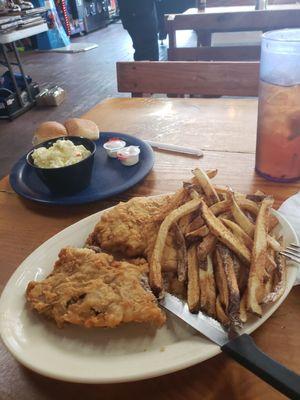 Chicken fried steak with fries and potato salad.