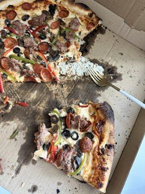 Burnt and thin crust stuck to box