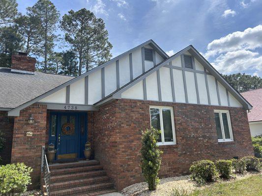 Painted stucco, trim, and windows