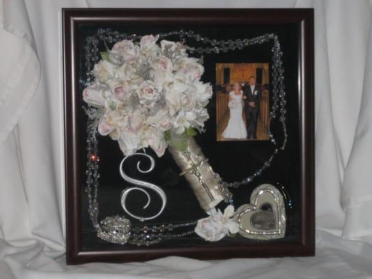 A gorgeous bouquet preserved and framed with memorabilia from the wedding day.