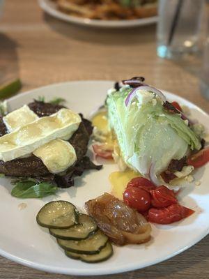 Delicious burger no bun with Brie and a small wedge salad instead of fries.