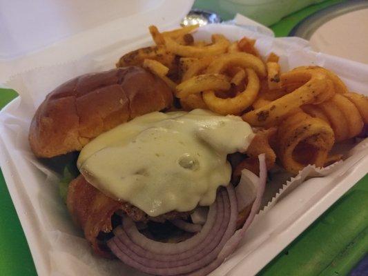 Burger with bacon, red onion, provolone and a side of curly fries.