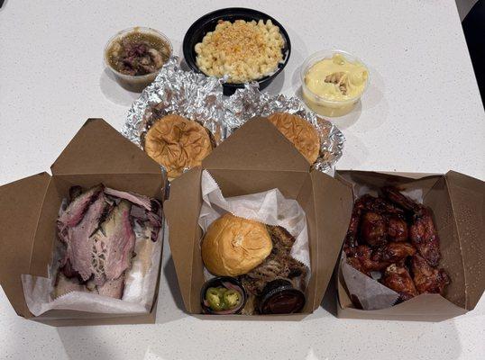 Delivery - pictured is brisket , pulled pork sandwich, a dozen bbq wings, 2 buns, banana pudding, Mac n cheese, GREEN CHILE BRISKET STEW