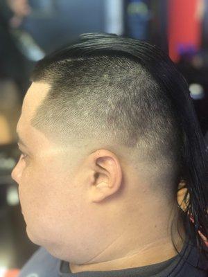 Enjoy a cold beverage while you get a full supreme service including a cut,wash and style in a gentlemen's atmosphere