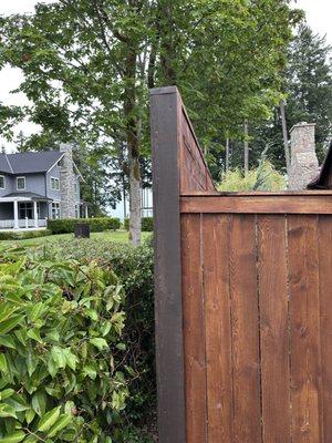 Cedar fence corner posts wrapped