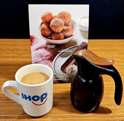 Coffee and their delicious syrup on standby to be poured over their delicious pancakes!