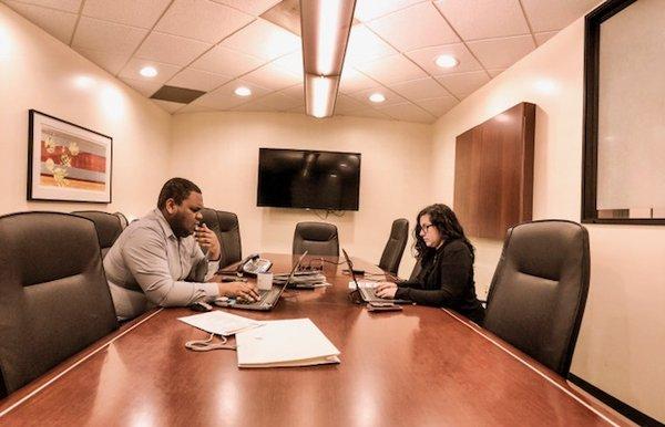 Team Working in Shared Office Space/Conference Room