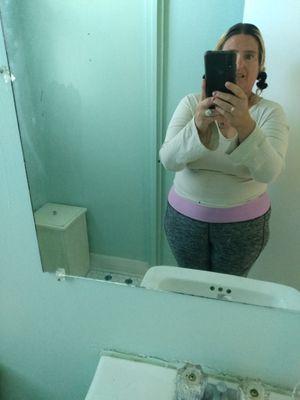 Five foot two blonde hair, green eyes heavy set