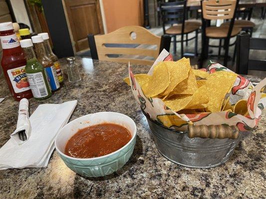 Chips need some work; salsa is mild but not bad