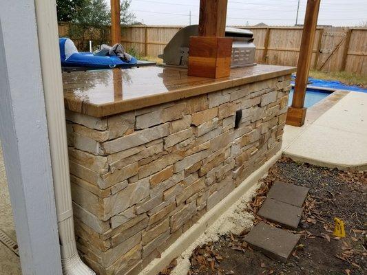 Stone fascia and Teakwood stone countertop