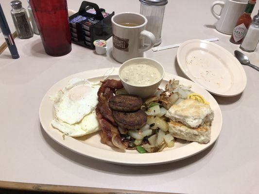 Yummy home fries sausage bacon biscuits and gravy