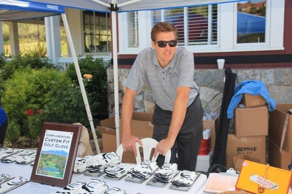 Jordan with GTS assisting with our Custom Gloves at a tournament