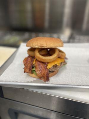 Bacon cheeseburger with onion rings.