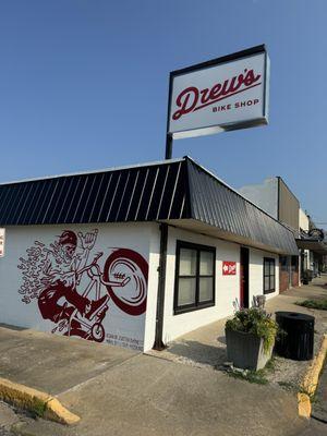 View of signs and mural on the corner of State St and Bridge St