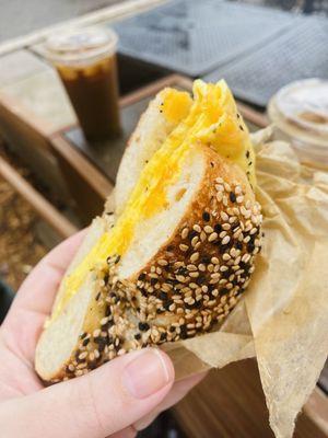 Egg and cheese on a sesame bagel