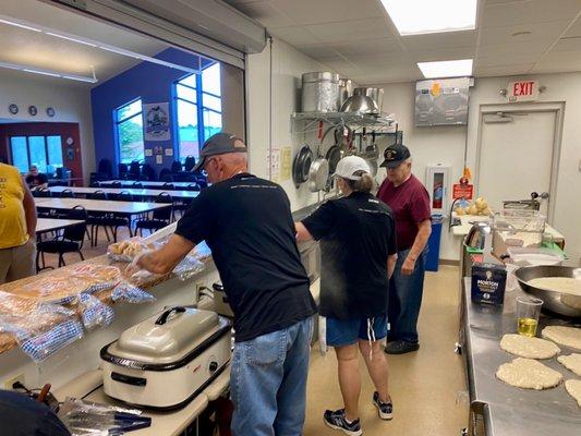 Serving up chow at a brat fry