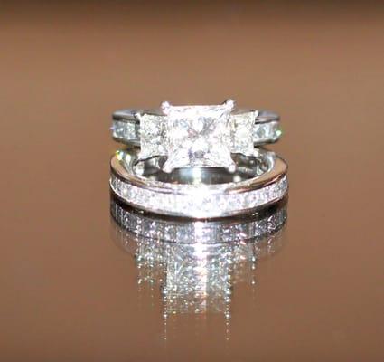 custom made: platinum channel set princess cut 3/4 eternity bands, side stones .53 carats, center stone - use ur imagination ;)