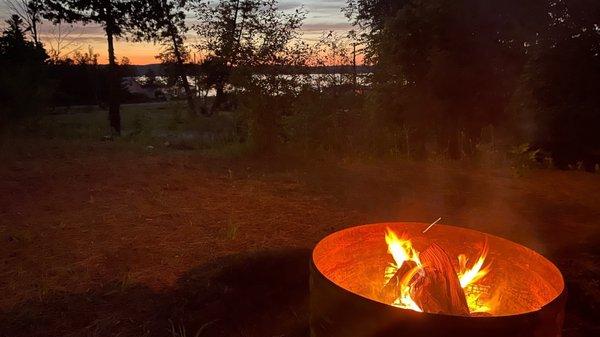 Evening fire and sunset looking over Lake Leelanau.