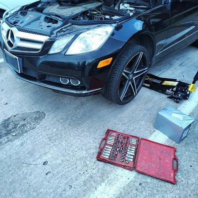 On-site suspension and front-end repair performed safely with professional jacking equipment and full tool setup, no tow required