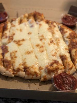Cheese Bread.  Thick, chewy, and cheesy. Plenty of sauce.