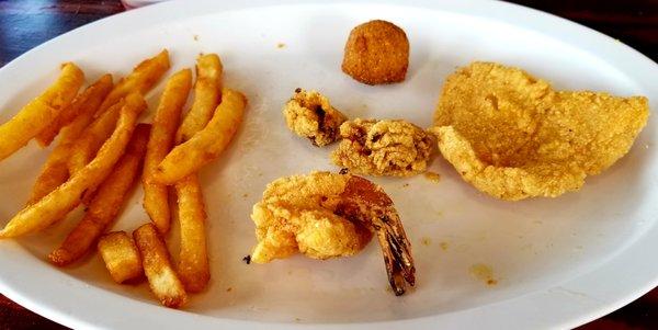 My portion of the fried platter with 1/2 of a fish fillet (not whole) and the smallest oysters I have ever eaten.