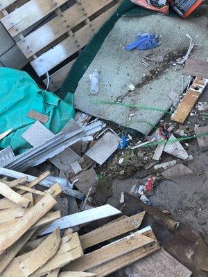 This is how J H Flooring left my front yard-the old floor and rug were never disposed of at completion, per our quote.