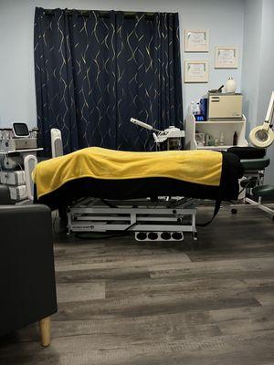 Facial and body sculpting room.