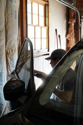 Jasper Working on tint for a Nissan Rouge