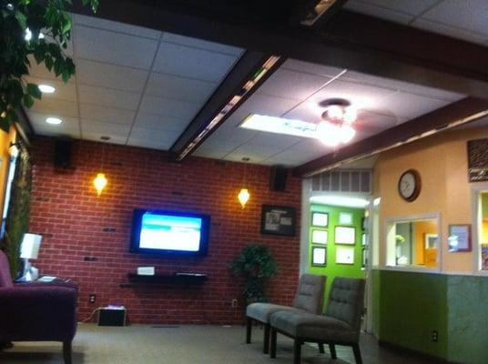 The waiting room, with keurig coffee/tea. They also have bottled water and juice. When you leave you get a fresh carnation.