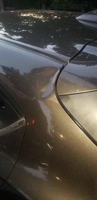 This dent was done by the guy head when fell over my car.