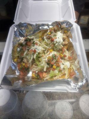 Two dollar tacos! Shredded chicken tacos on corn tortillas. The pico de gallo is fresh made, fresh cilantro, and corn.