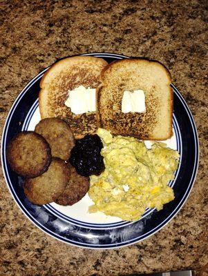 Toast made on the stove with butter on it, 4 breakfast sausages, soft scrambled eggs grape jelly $12.00