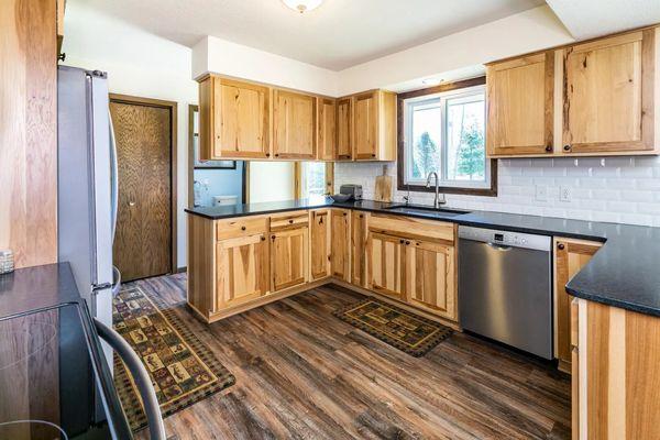 HomeCrest Custom Cabinets , BeauFlor Luxury Vinyl Plank , Solid Surface Tops