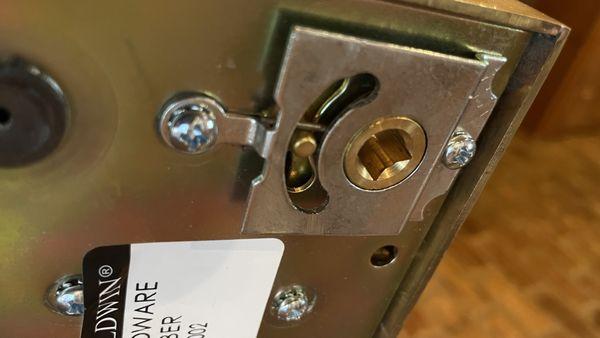 section of lock that is not flush and was told not to worry about and simply tighten the lock down.