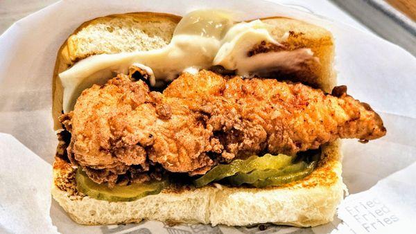 Slide, slide, slippity slide. Chicken Slider on 2 Hawaiian roll, pickles, aoli.  Satisfying + good w/Nashville hotsauce.