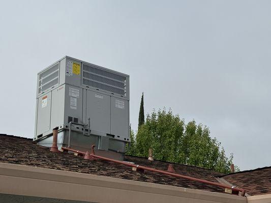 New AC unit with painted drain pipes